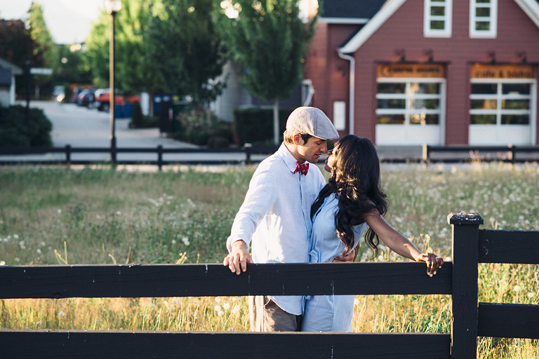romantic engagement photo by a fence