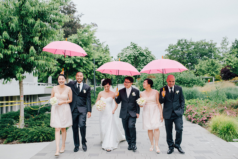 rainy wedding day photos pink umbrellas