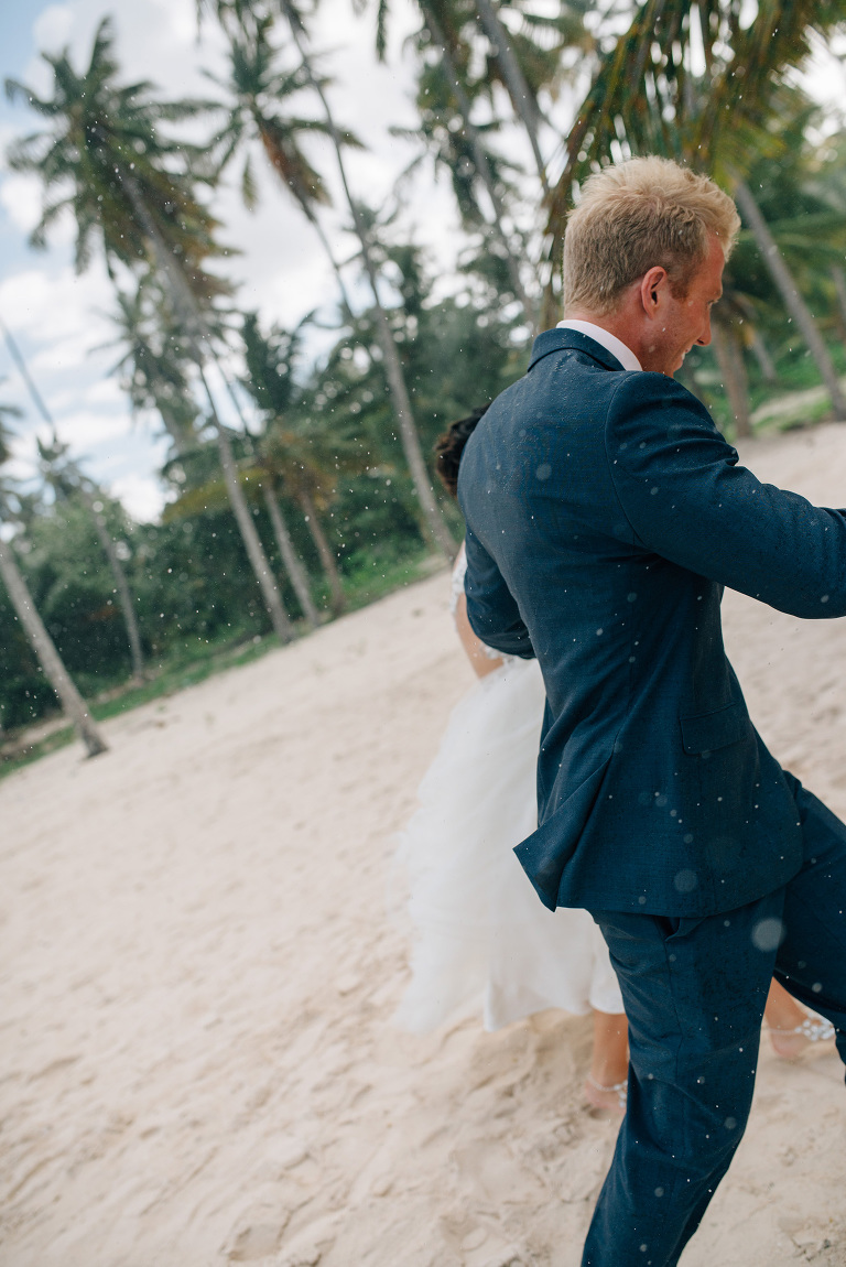 downpour of rain on the bride and groom
