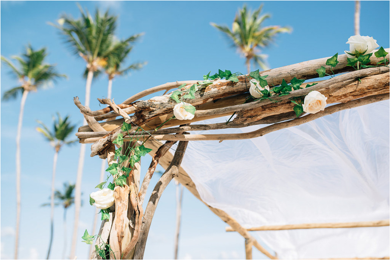 driftwood and flower ceremony arch