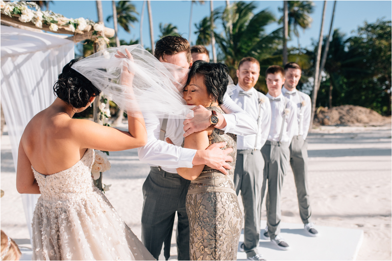 groom hugging brides mom