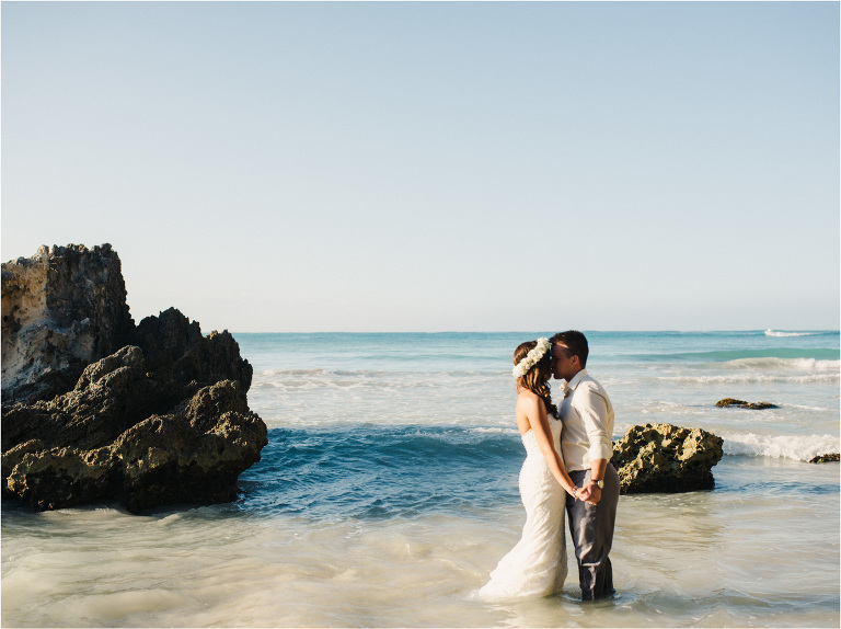 bride and groom in the ocean