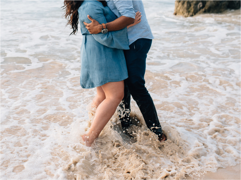 feet in the water waves crashing