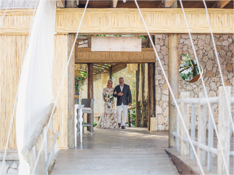 bride walking down aisle with dad
