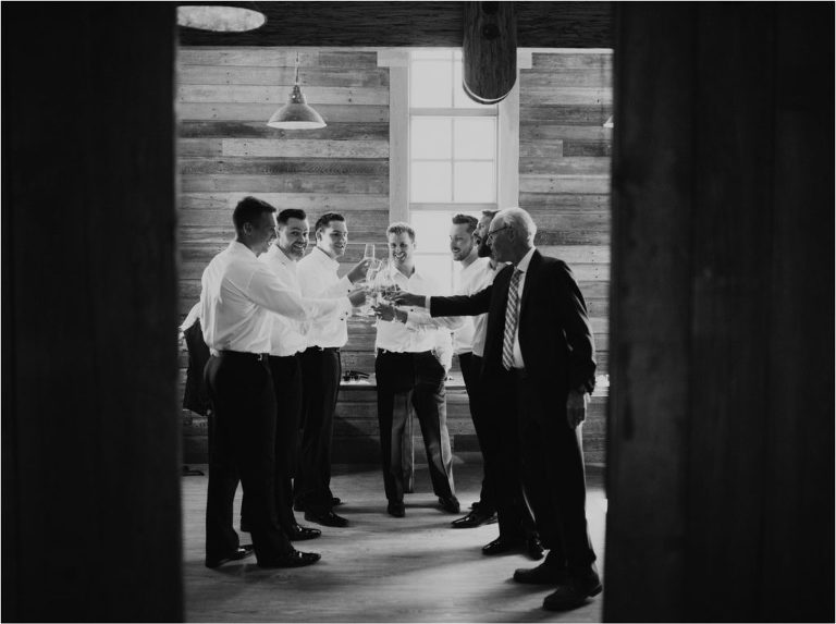 groom and groomsmen toast on wedding day okanagan winery wedding naramata bc penticton bc red rooster