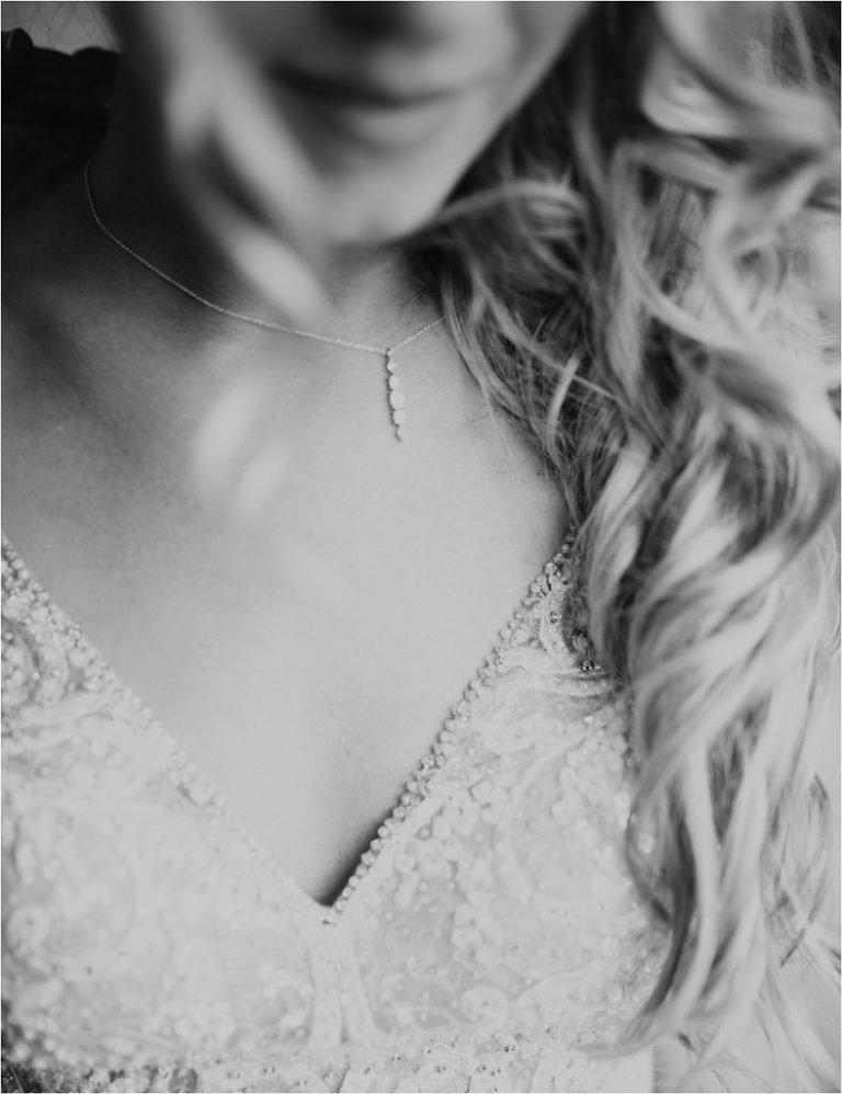 bride putting on jewelry okanagan winery wedding naramata bc penticton bc red rooster